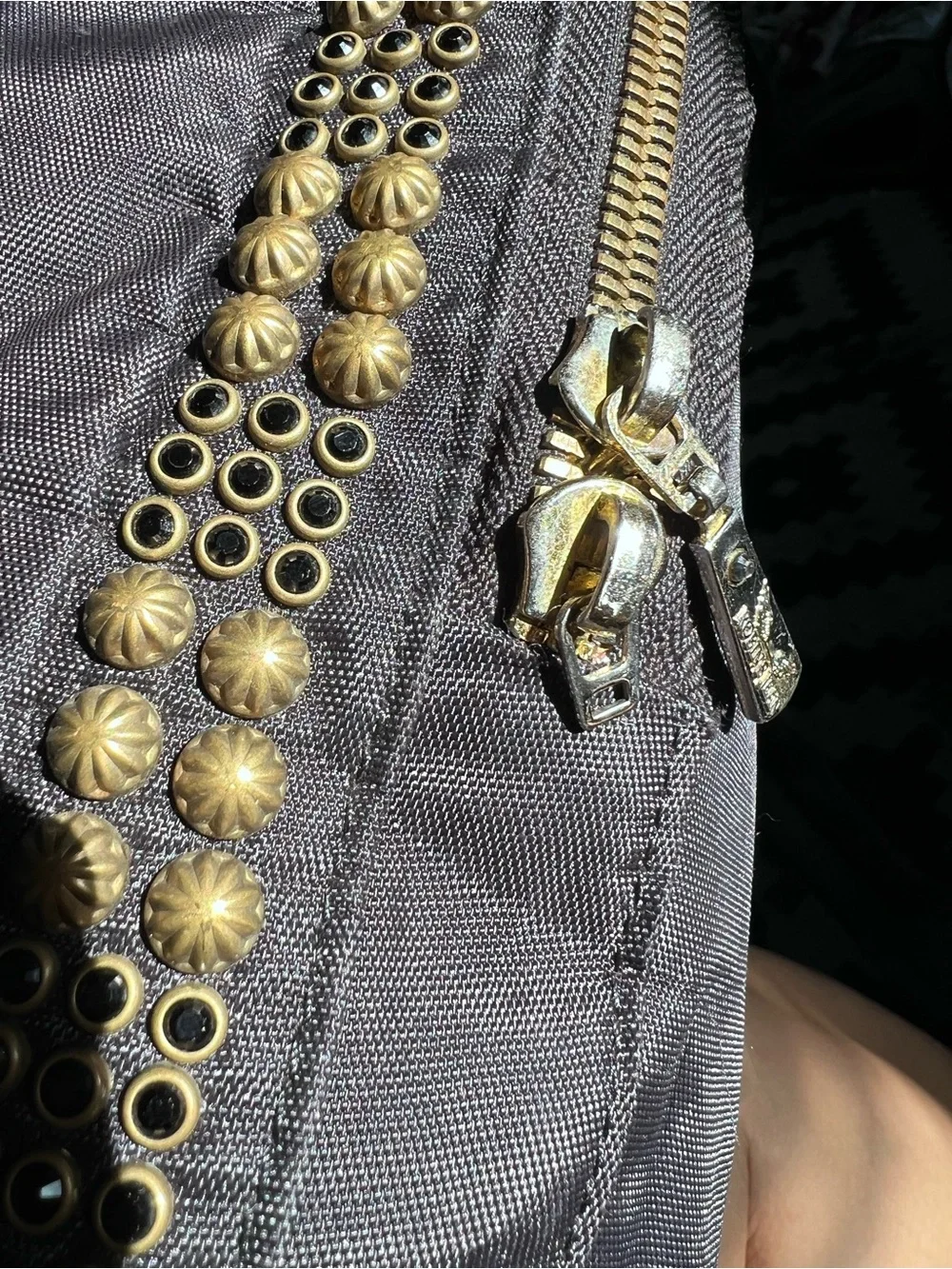 Jean Studded Backpack designed with an edgy  streetwear aesthetic.